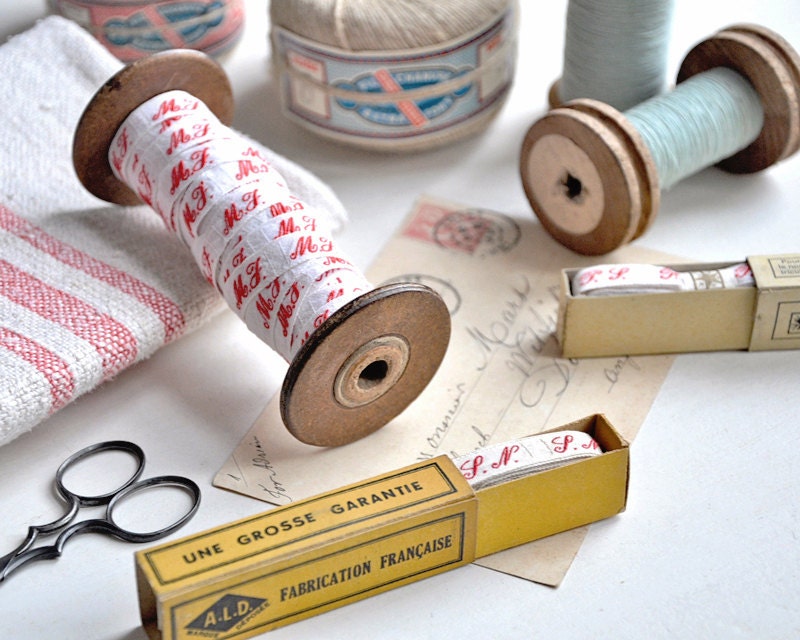 a box of vintage french laundry labels - letters