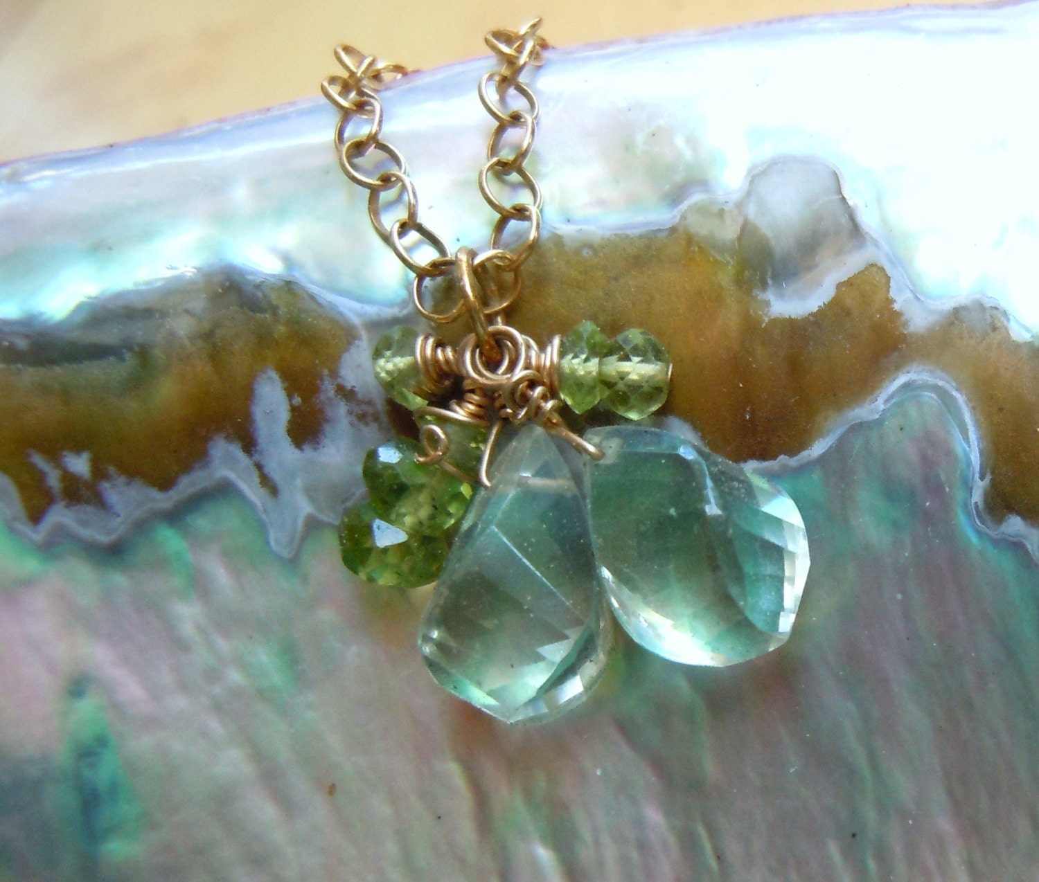 Green twisted Amethyst gems with peridot on a gold chain necklace