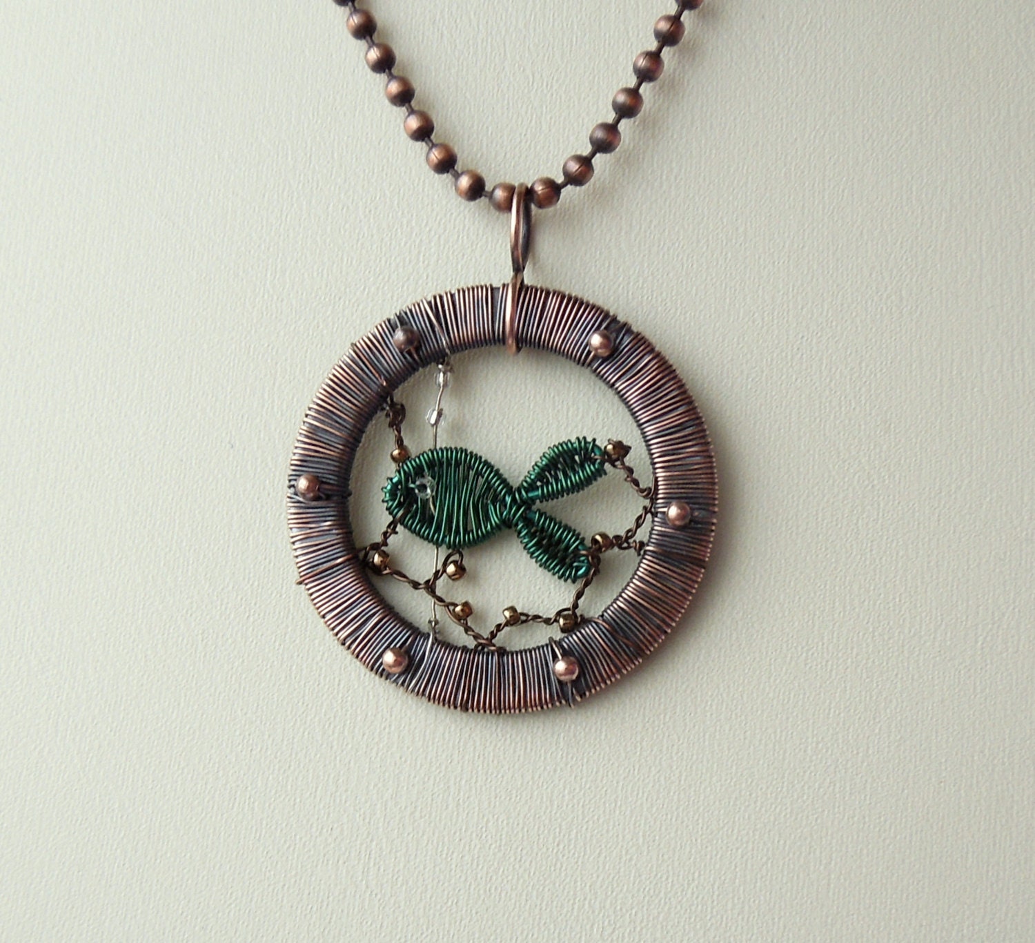 Porthole wire wrapped pendant with woven fish and ball chain