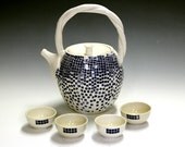 Ceramic and pottery tea set with four matching tea bowls