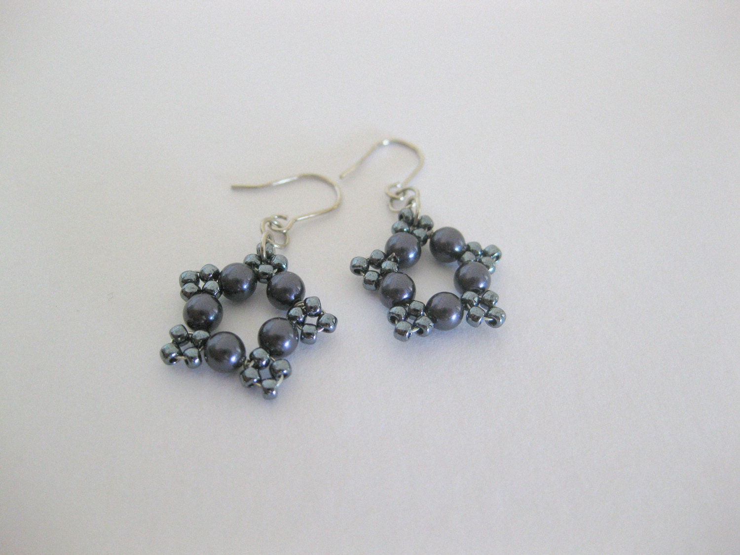 charcoal grey beaded star earrings. Lightweight simple everyday earrings.