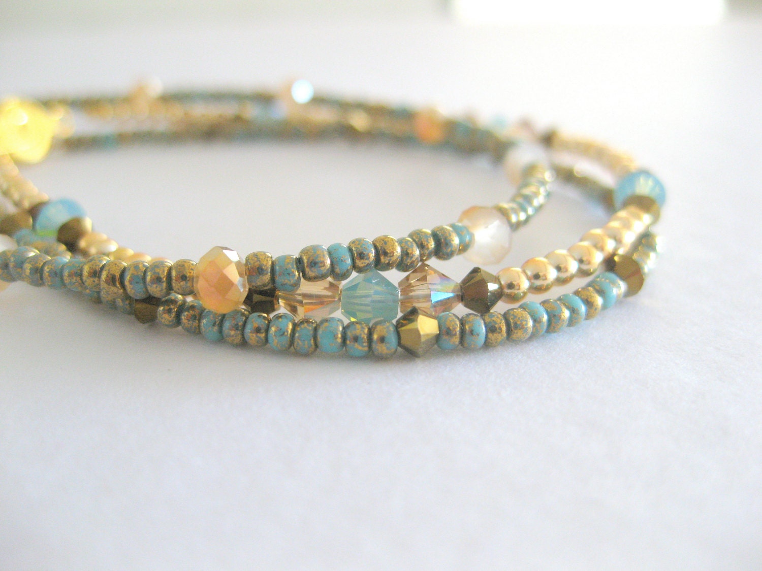 Seet of three bohemian inspired teal turquoise friendship bracelet.