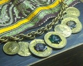 WORLD TRAVELER. Upcycled Vintage Worldly coin charm bracelet with amber, emerald and purple glass cameo  centers