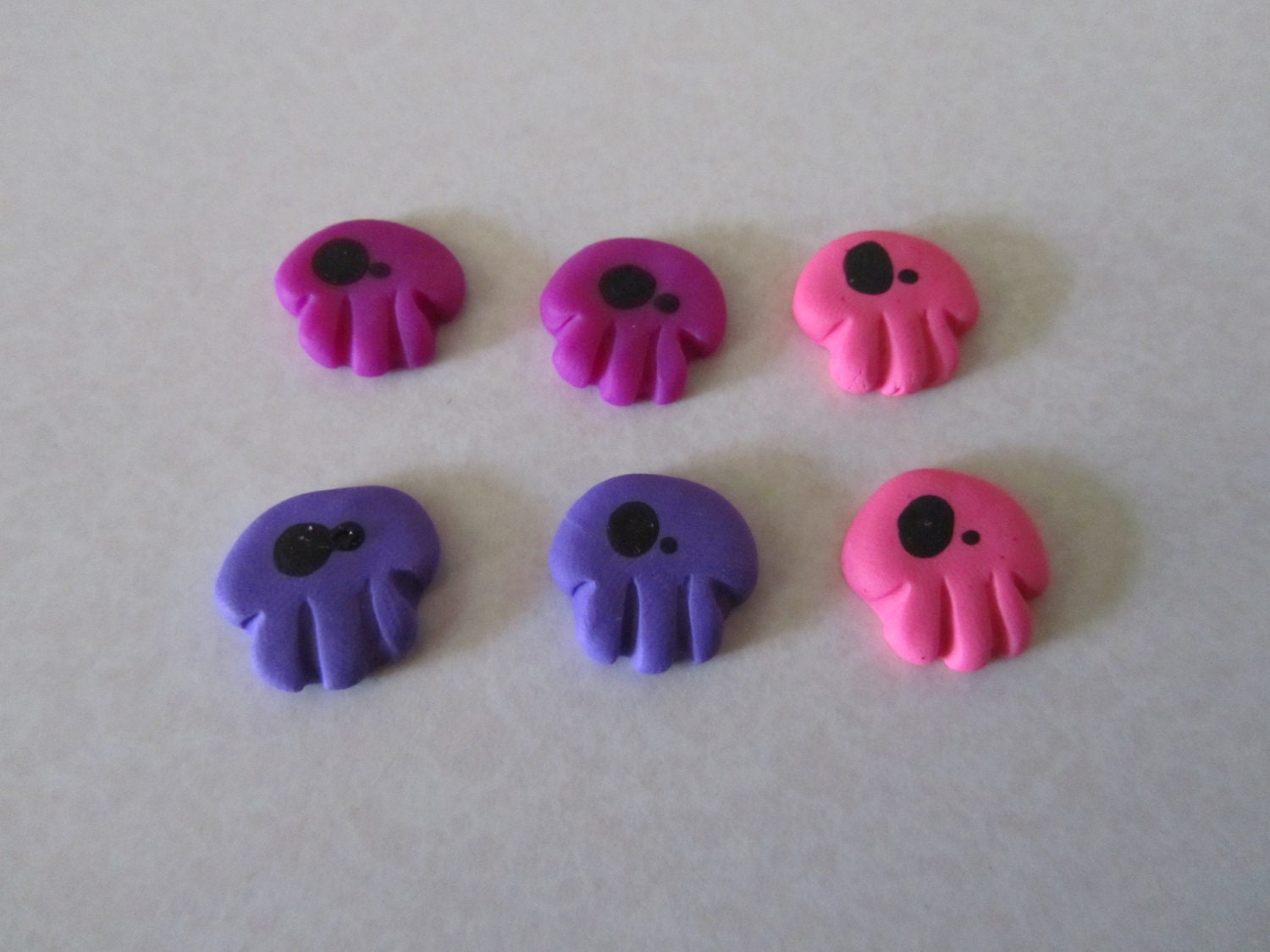 Creepy Cute Wonky Eyed Skulls pink purple mix
