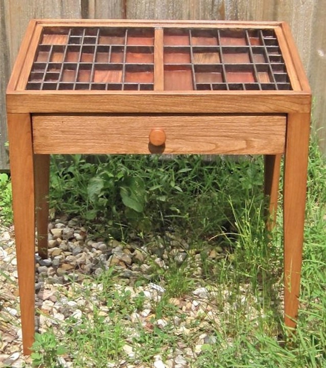 Accent table with an inlaid top and drawer