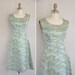 rare 1950s dress / 50s novelty satin dress / 1950s bombshell serene print dress