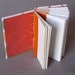 Small journal or baby shower guestbook with colorful animal print covers