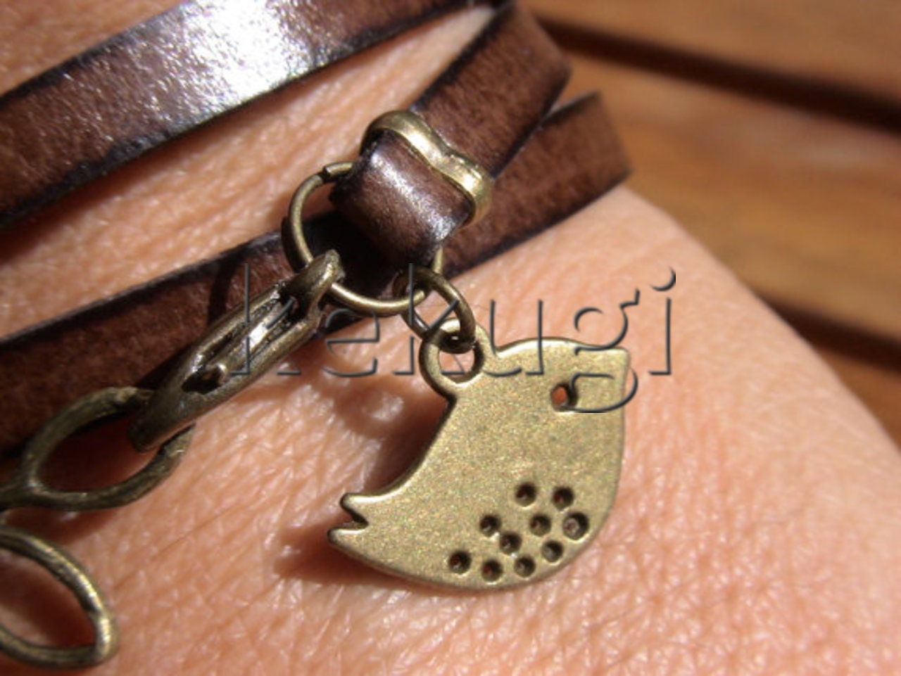 multi wrap dark brown togo flat leather bracelet with brass leaf connector and bird