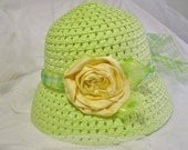 little girls Easter hat in spring green and yellow