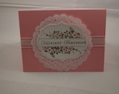 Happy Birthday Card in Pink Floral design with doily and white ribbon