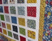 Simply ABC 123 54x60 quilt in vintage looking fabrics of red, green, yellow, blue and black