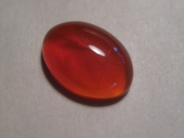 Orange  Mexican Fire Opal cab  ..........   13 x 9 x 4 mm ............      a1522