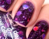 Nail polish - "Cosmic Forces" holographic dot glitter in a dark purple base