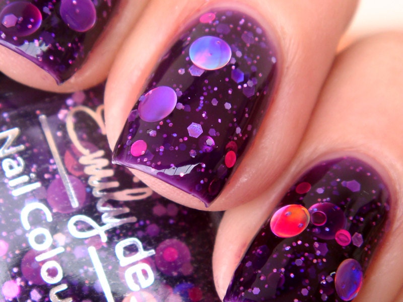 Nail polish - "Cosmic Forces" holographic dot glitter in a dark purple base