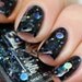 Nail polish - "Dark Forces" holographic silver dot glitter in a black base