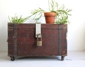 antique box trunk on wheels