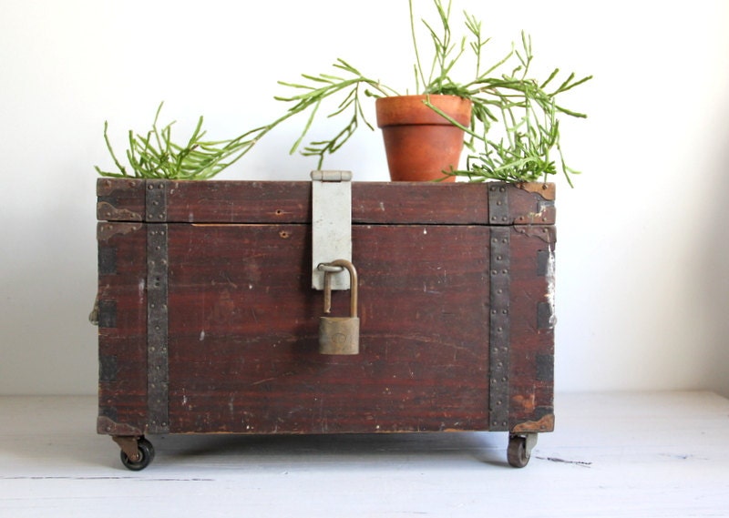 antique box trunk on wheels