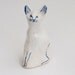 Ceramic cat figurine in white and blue