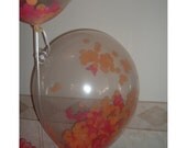 Set of 3 Clear balloons filled w/ confetti. 1 Yard of Tissue paper tassel.