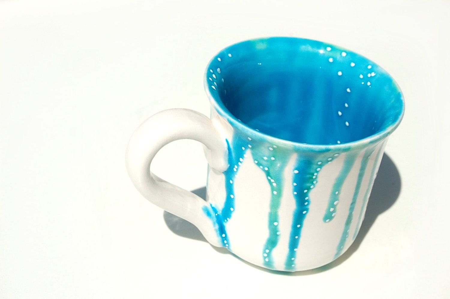 Coffee cup with drips of blue and white dotting