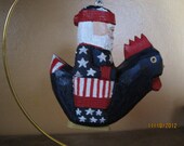 Pratriotic Santa riding a chicken ornament