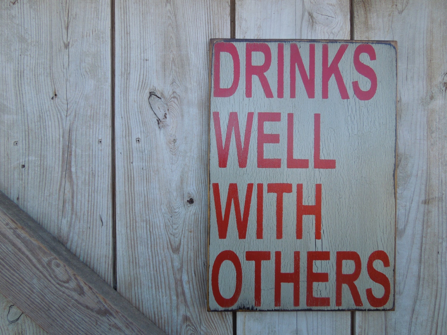 Drinks well with others sign made from reclaimed plywood