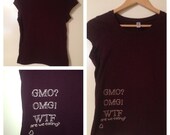 GMO OMG WTF, Size: M, tan on burgundy tee
