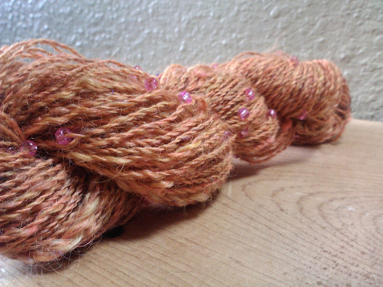Tweed wool, mohair, and recycled sari silk yarn, HANDSPUN with pink glass beads