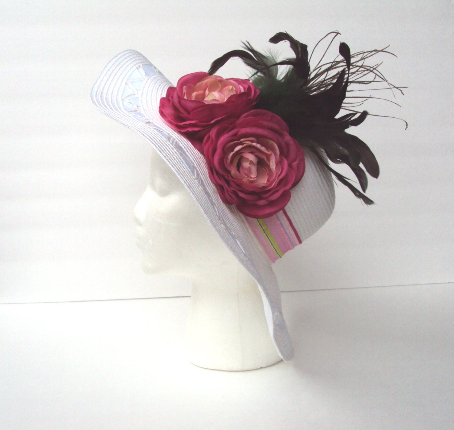 White Wide Brim Spring Embellished With 2 Fuchsia Rananculus Flowers Striped Ribbon & Dark Green Feathers