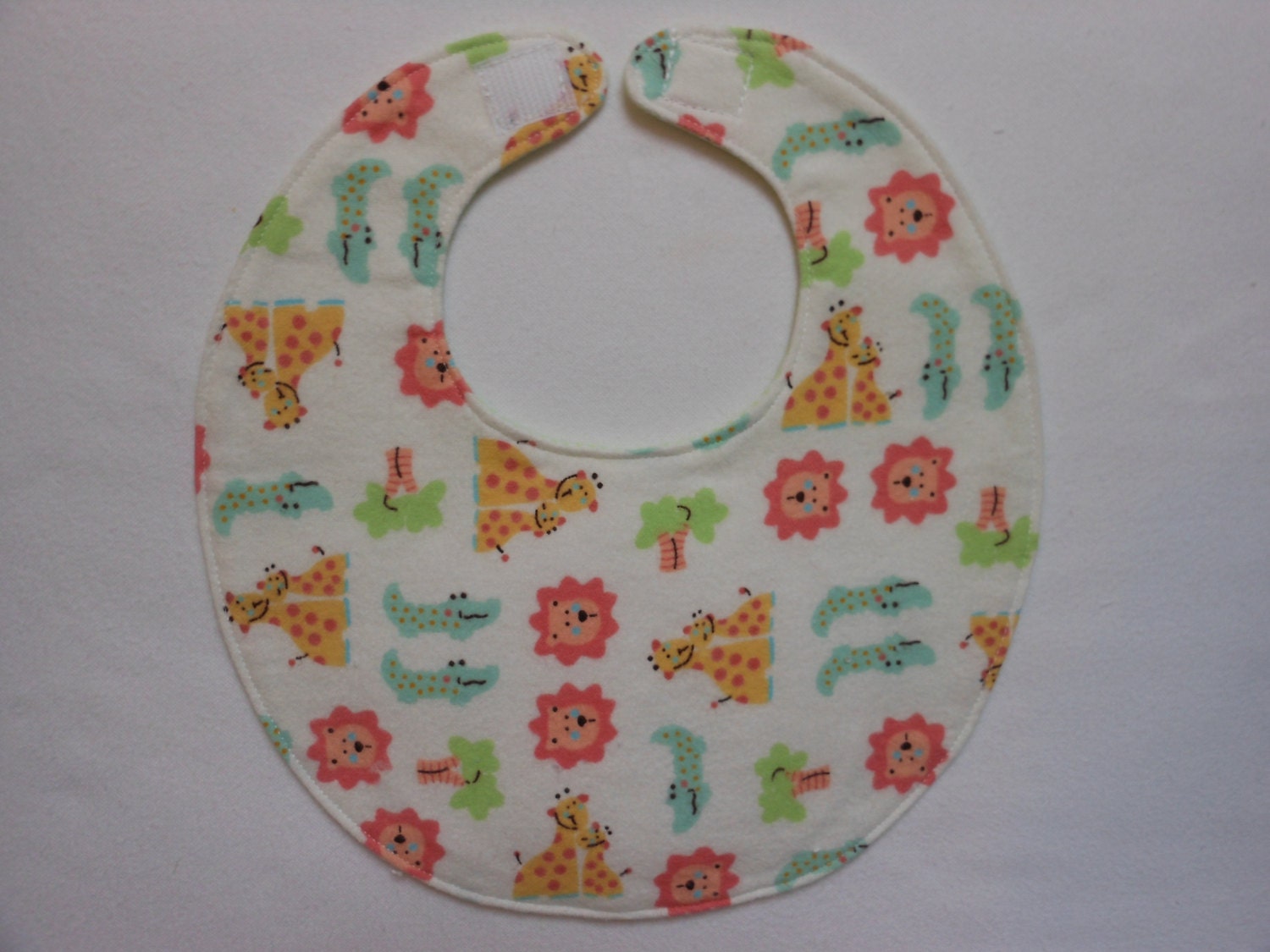 Baby bib, four soft layers, reversible, white with zoo amimals
