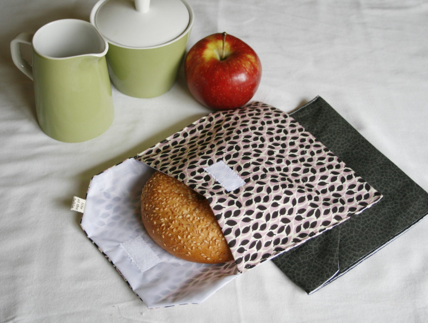 pair of reusable, lined sandwich bags in purple leaves & charcoal