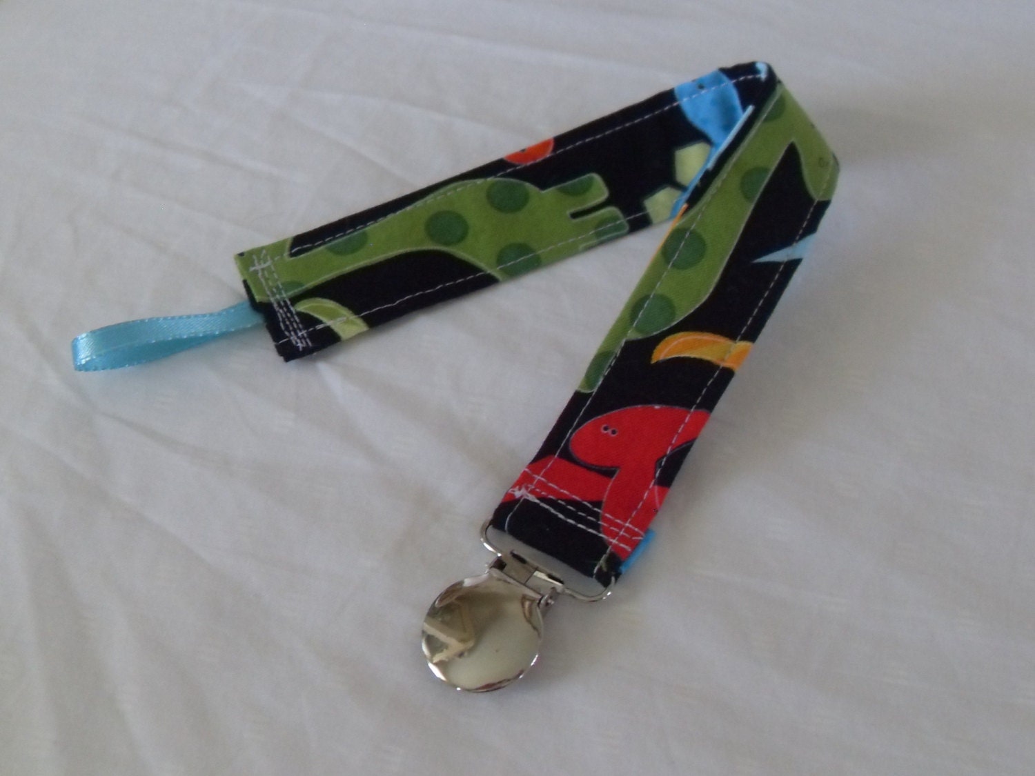 Urban Zoologie Dinosaurs Bright Pacifier Clip