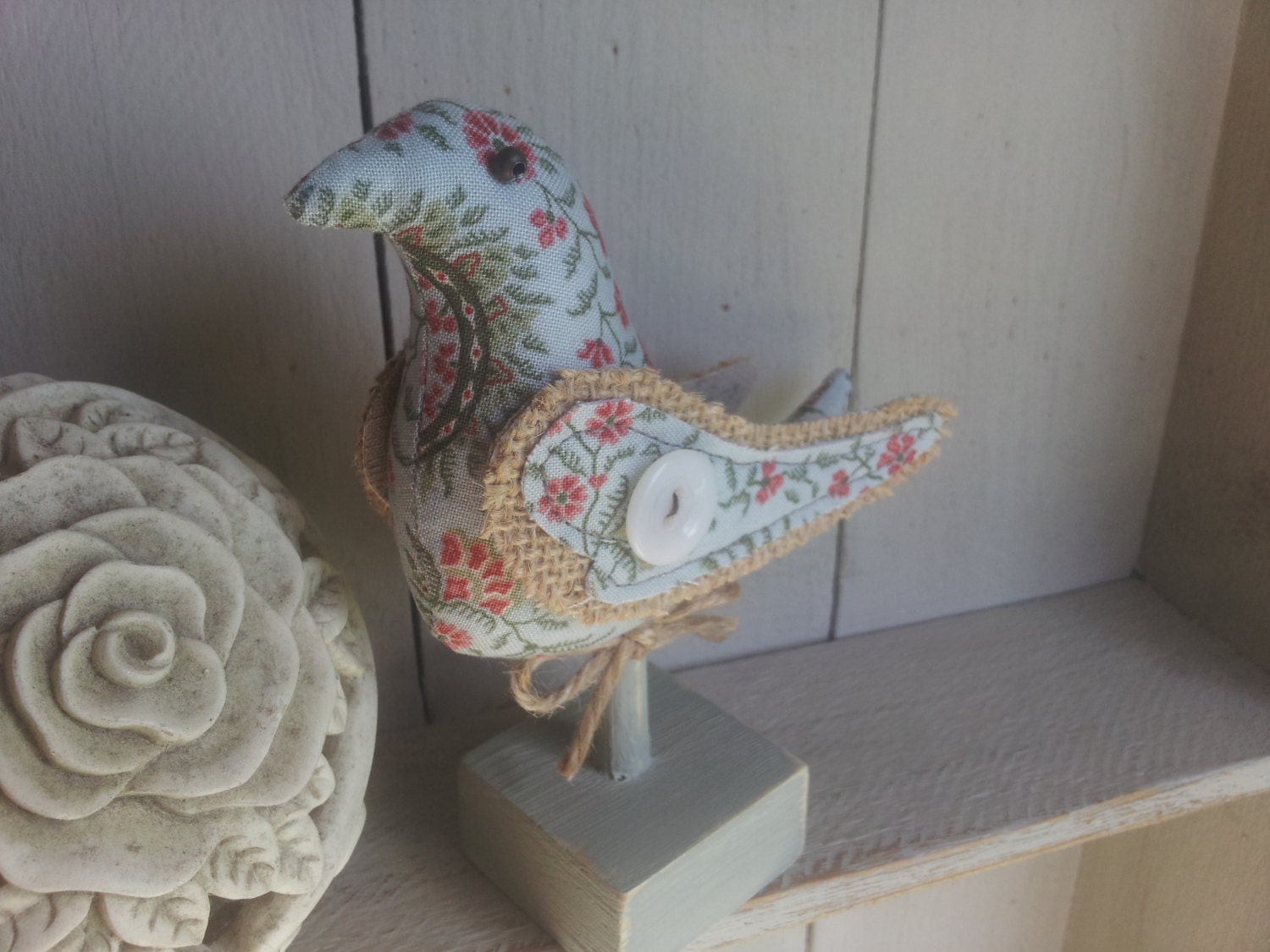 Paisley fabric bird on perch. 'Emile'