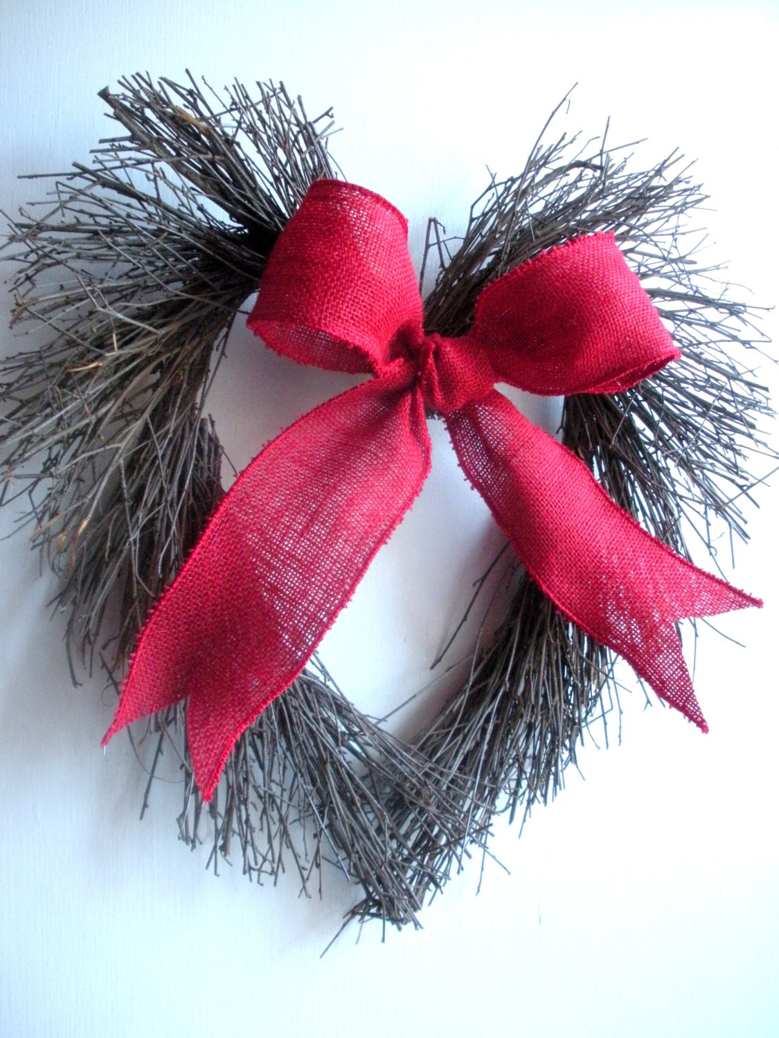 Valentines Day wreath with burlap bow, heart shaped