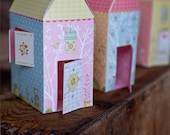 Set of 3 illustrated paper houses - pink, orange and red