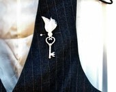 times long past . boutonniere . key with vintage mother of pearl button . for a cottage chic wedding