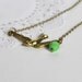 Flying Bird Necklace, Gold Colored Bird Jewelry, Green Czech Glass Bead and Sparrow, Canadian Jewelry