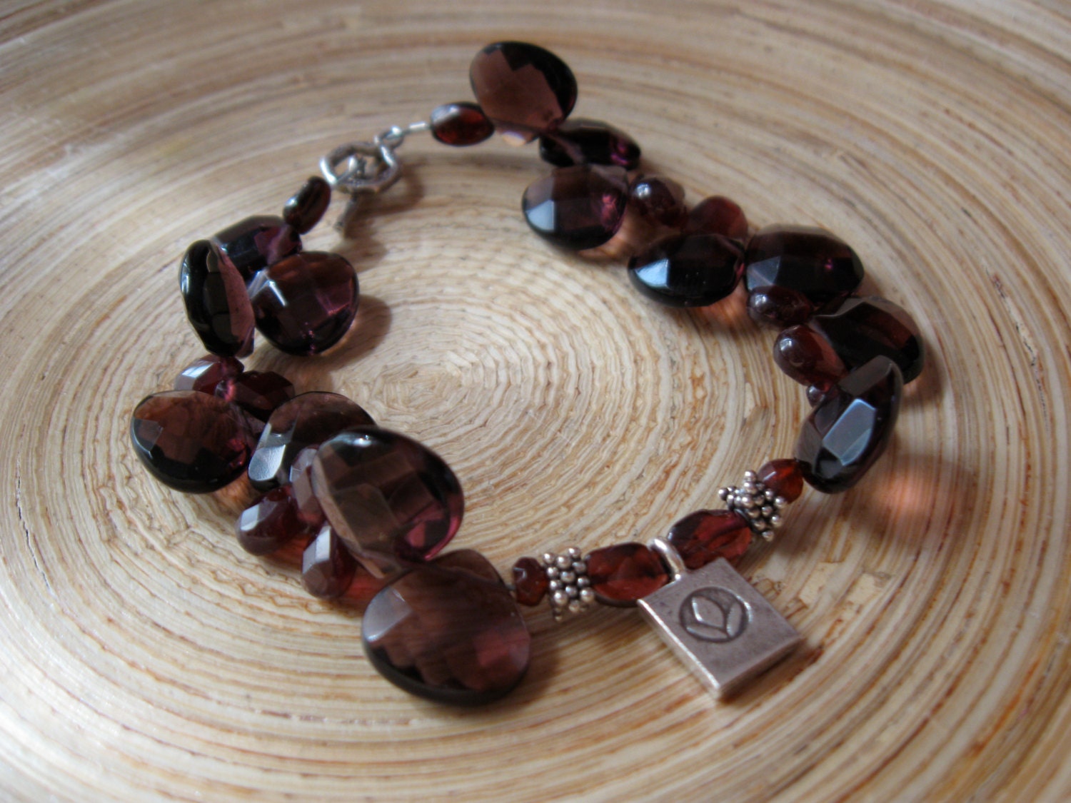 Lotus charm yoga bracelet with garnet and red fluorite briolettes / HIll Tribe beaded bracelet with fine silver lotus