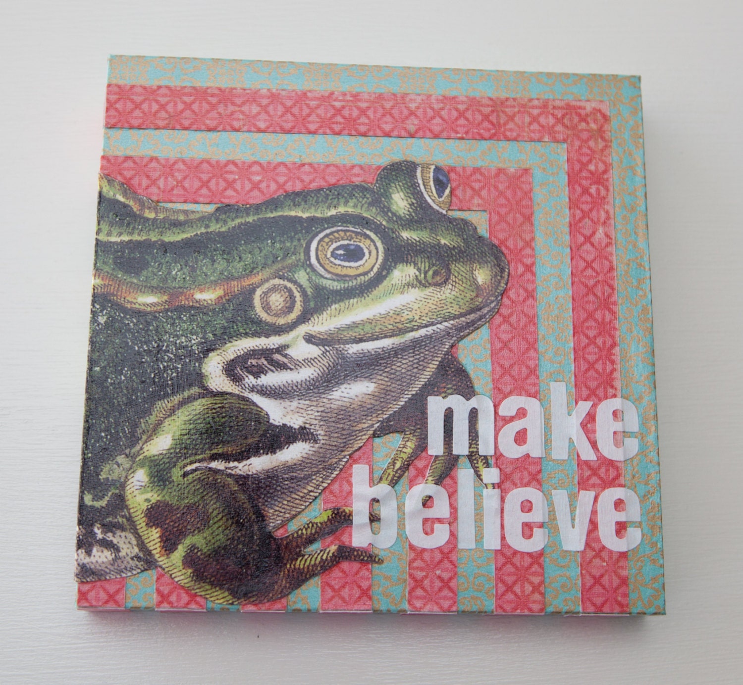 Make Believe collage on wood block