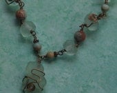 Stunning Wire wrapped Sea Glass Pendant is matched up with African Recycled Glass and Opal Imperial Jasper