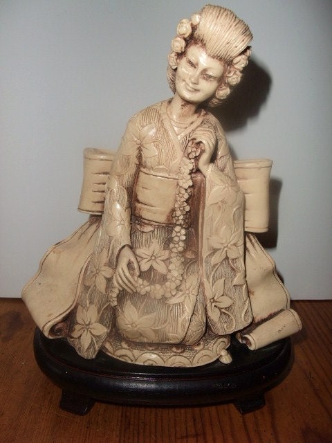 Faux Ivory or Mandarin Ivory Geisha Girl Kneeling Statuette on Wooden stand c 1920s