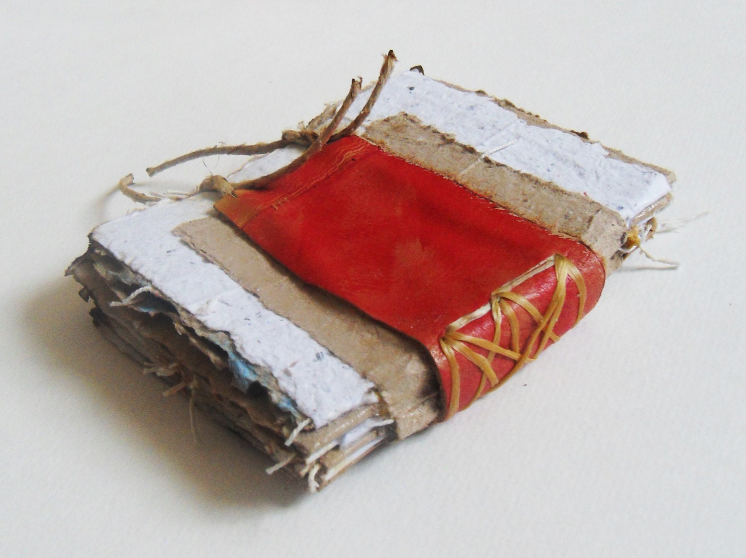 Handmade paper journal crude bound, red, brown, and white with handmade string paper. great idea for unique photo album