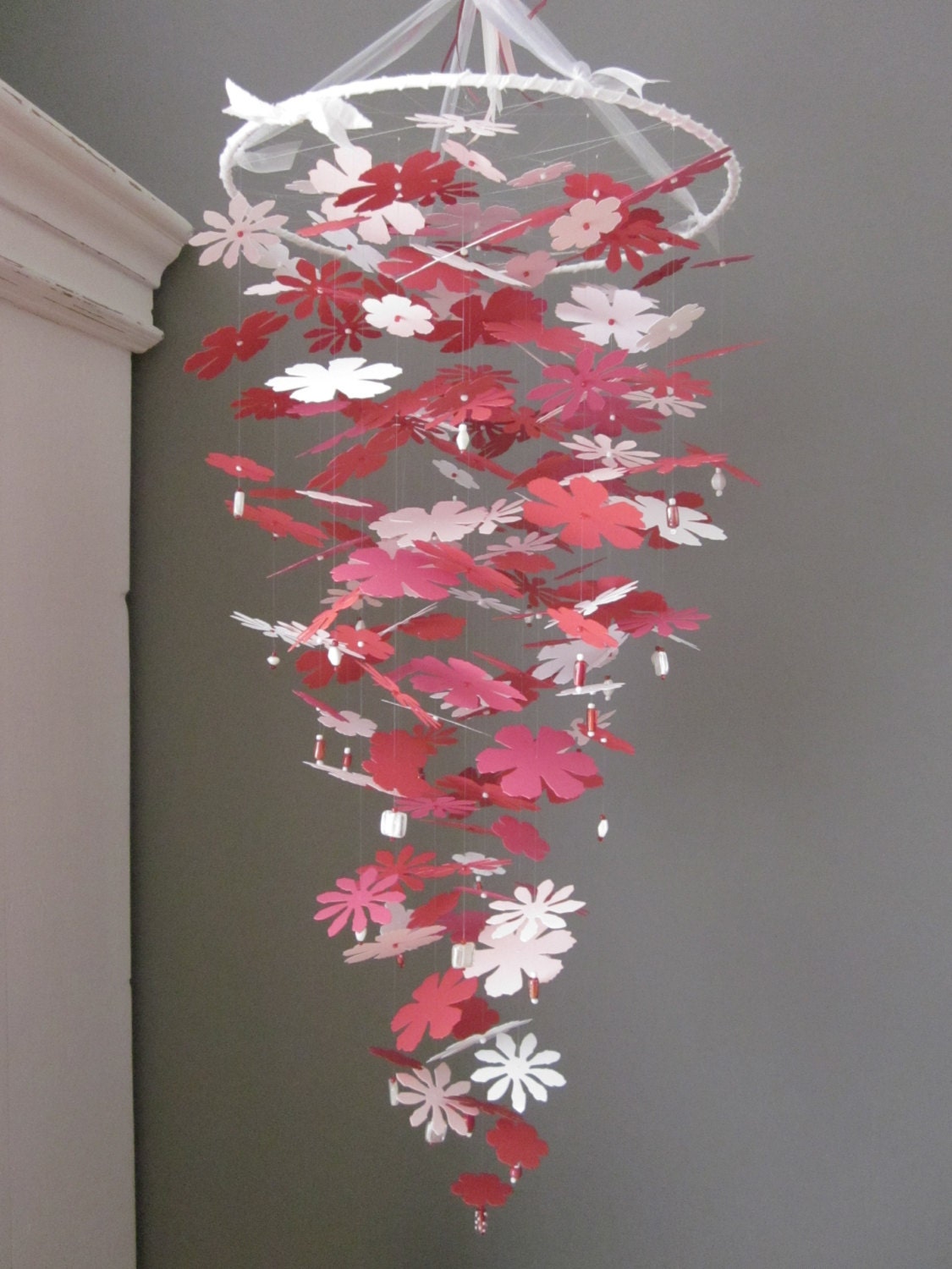Paper flower nursery mobile in poppy red, soft pink, white and warm hot pink---Bright colors for a nursery or as wedding decoration