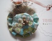 Handmade fabric flower brooch.