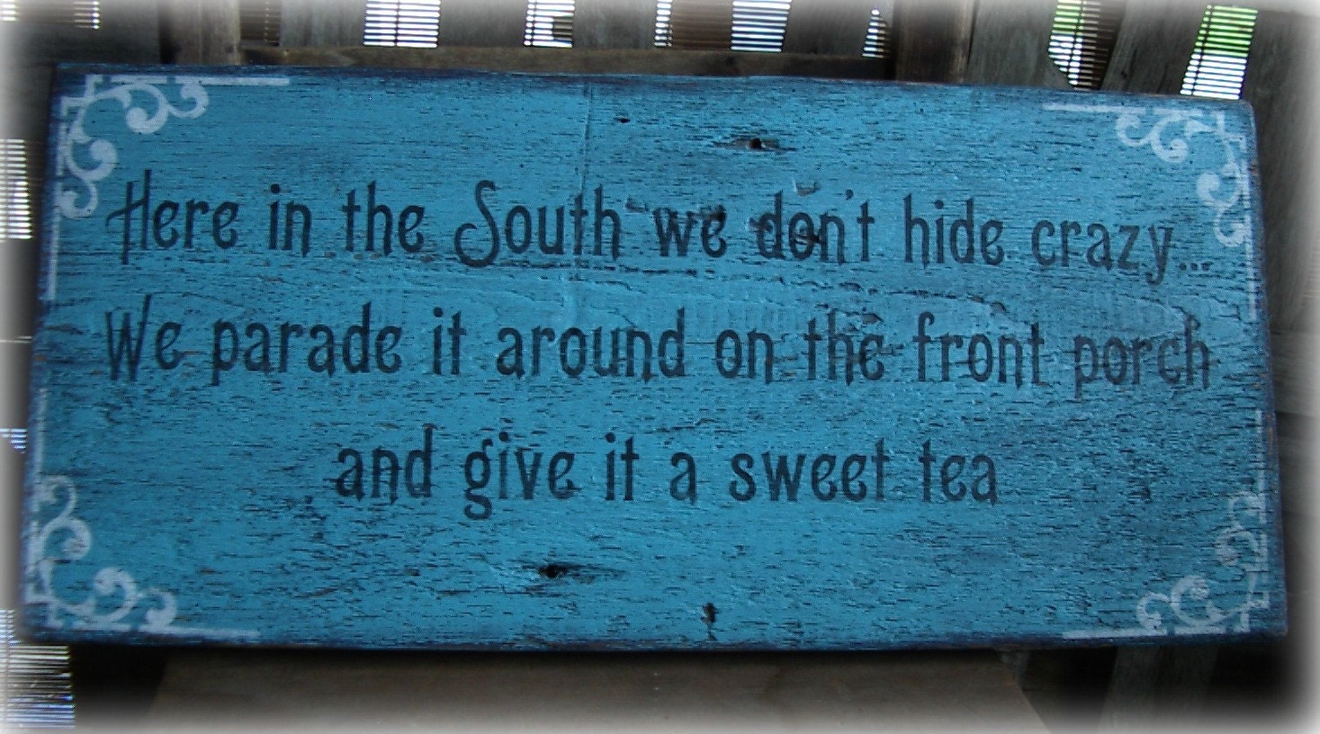 Rustic, hand painted "Here in the south we don't hide crazy" sign. Reclaimed barn wood, Turquoise Blue, Black, White.Humorous.