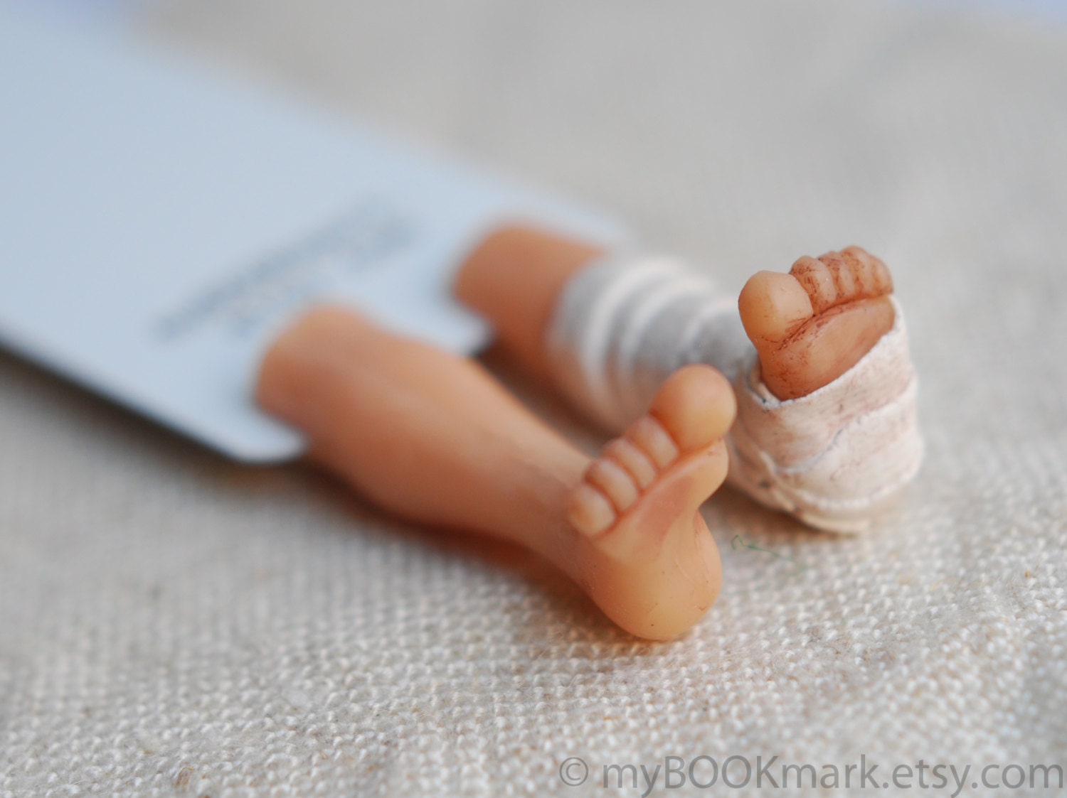 Broken leg in the book. Unusual art bookmark. Funny gift for children, kids, all, him, her. Neutral plaster