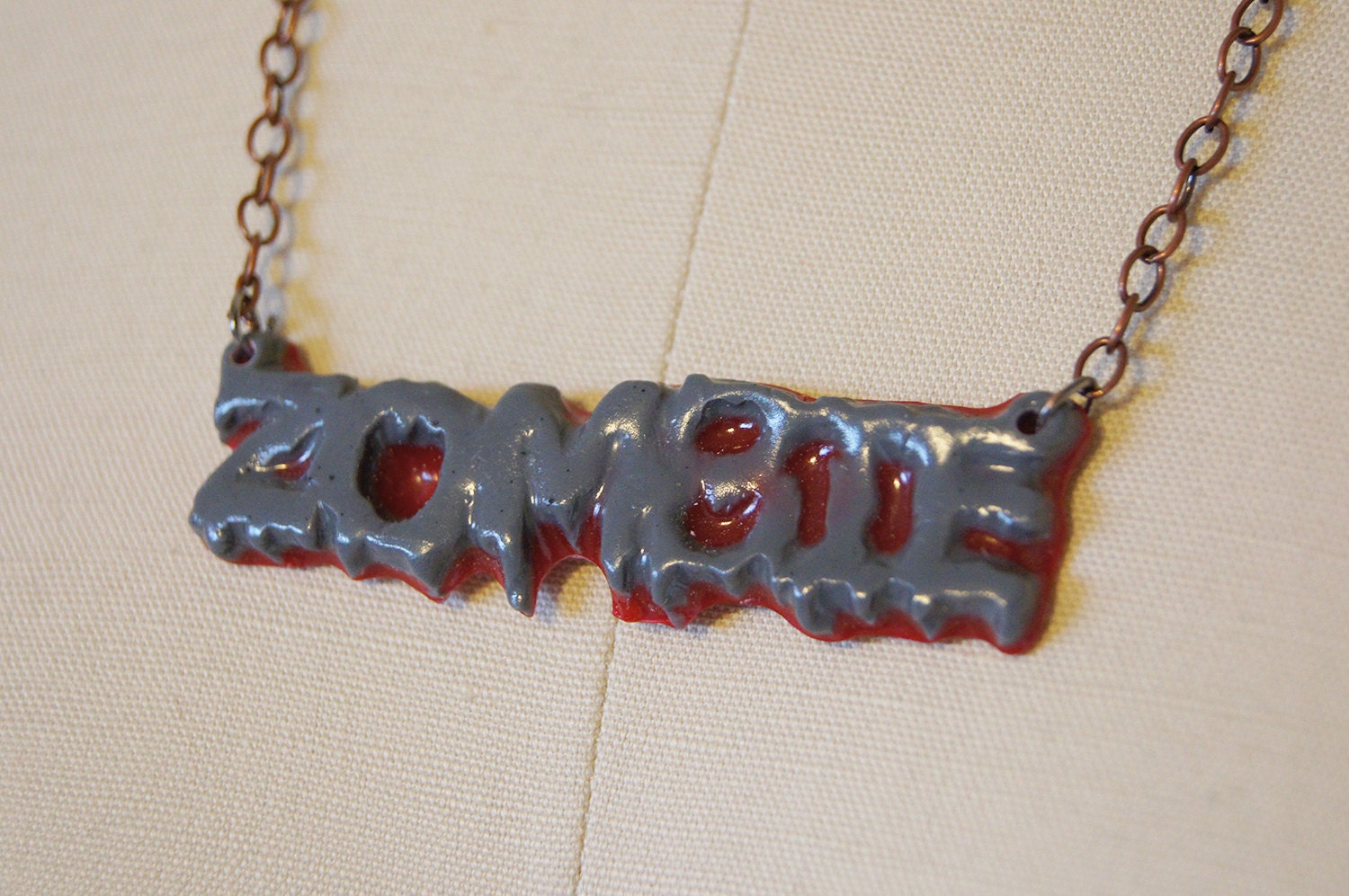Zombie Text Necklace, Gray and Maroon.
