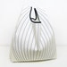 Reusable Shopping Bag, folded into a triangle, blue and white cotton, edged in black ribbon.