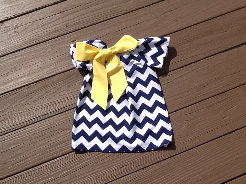 Girls Little Peasant Dress with fabric bow detail. Navy blue or any chevron fabric.  Custom children's clothing. By EverythingSorella