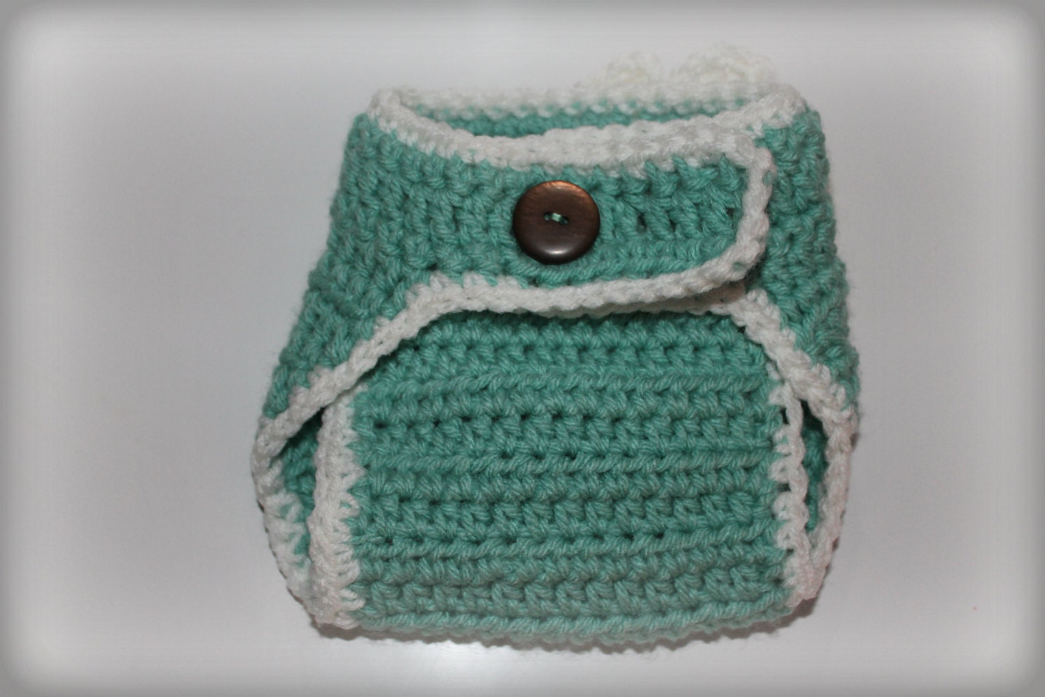 Newborn crochet diaper cover with flower and button- white, teal, green.